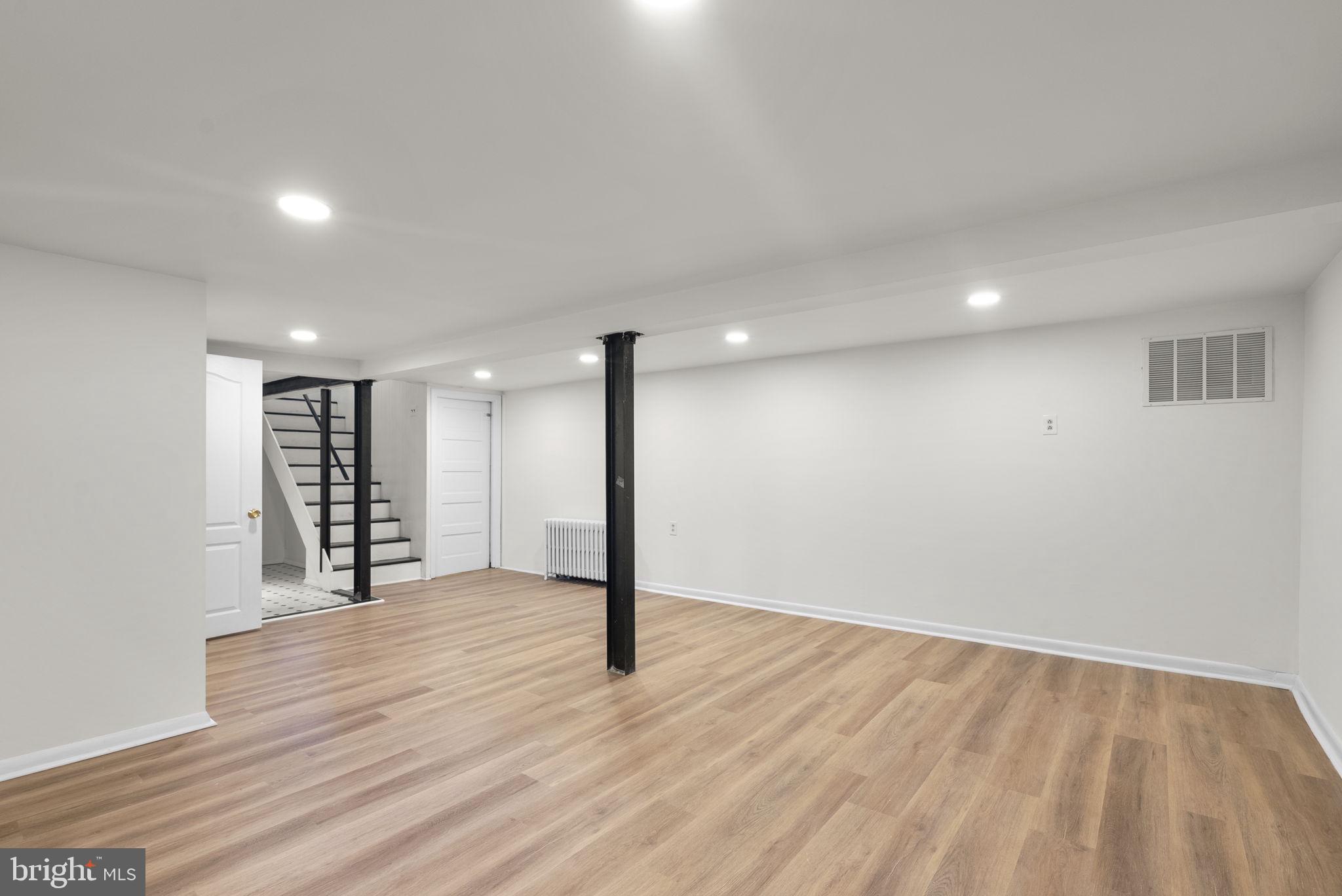 9120 Glenridge Road Silver Spring, MD 20910 - Photo 42 of 59 a view of an empty room with wooden floor