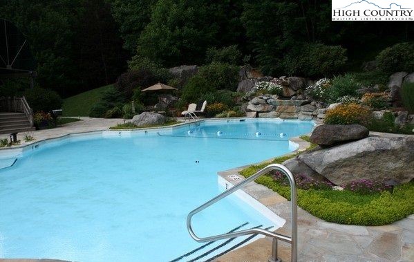 117 Ridge Drive Linville, NC 28646 - Photo 26 of 32 a view of a swimming pool with a yard