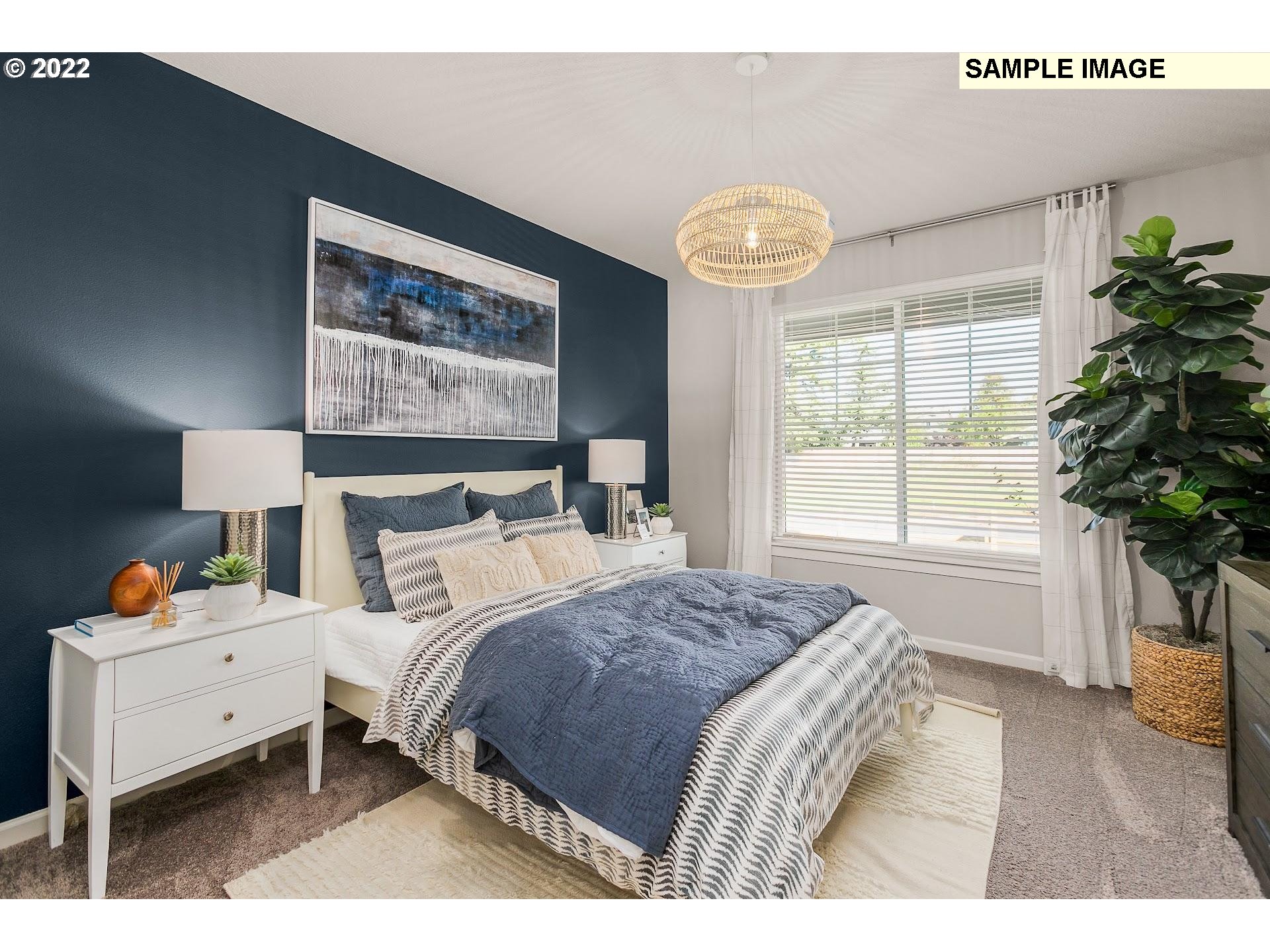 37413 Coho Street Sandy, OR 97055 - Photo 13 of 23 a bedroom with a bed and a large window