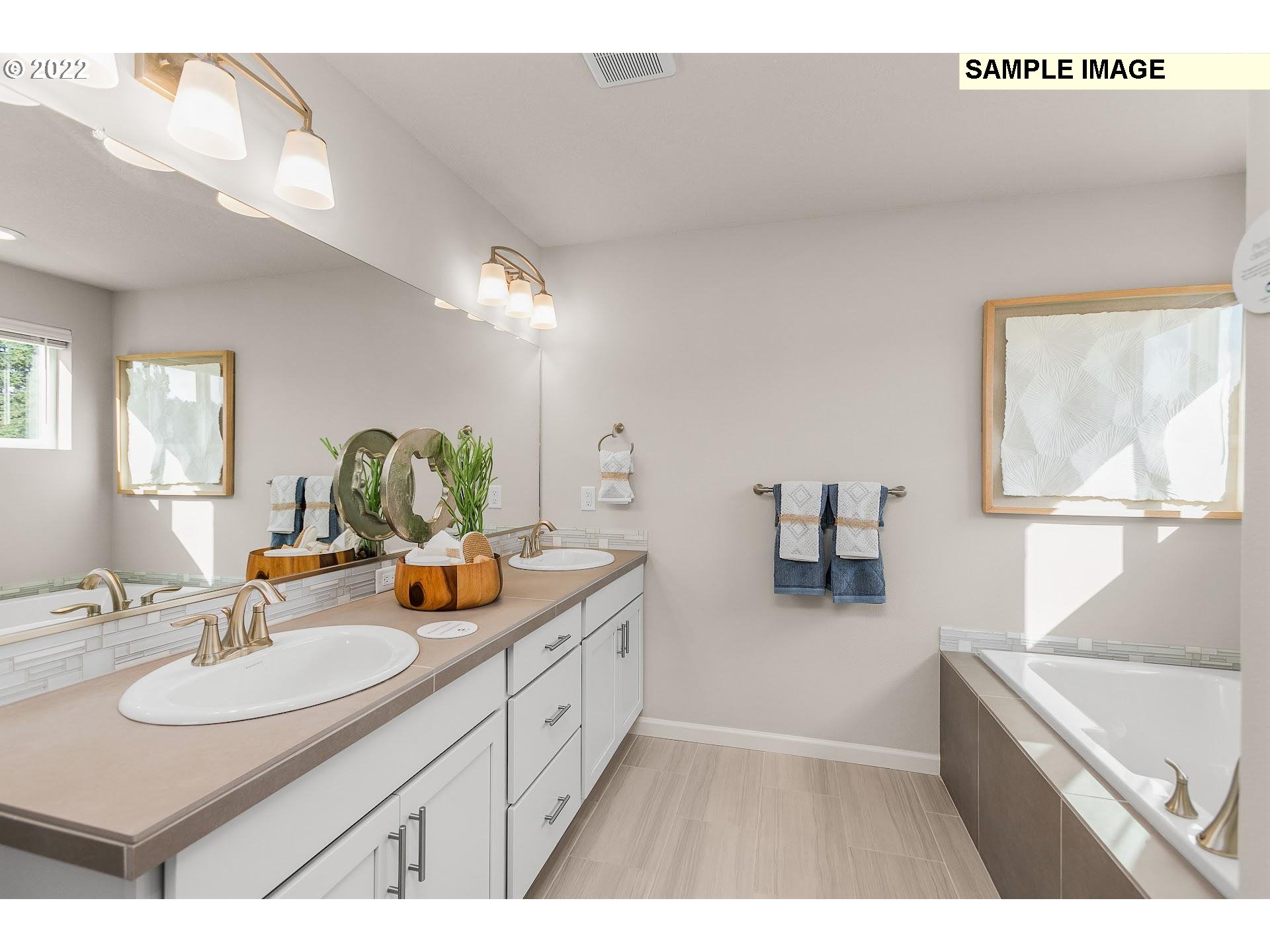 37413 Coho Street Sandy, OR 97055 - Photo 18 of 23 a bathroom with a sink and a mirror