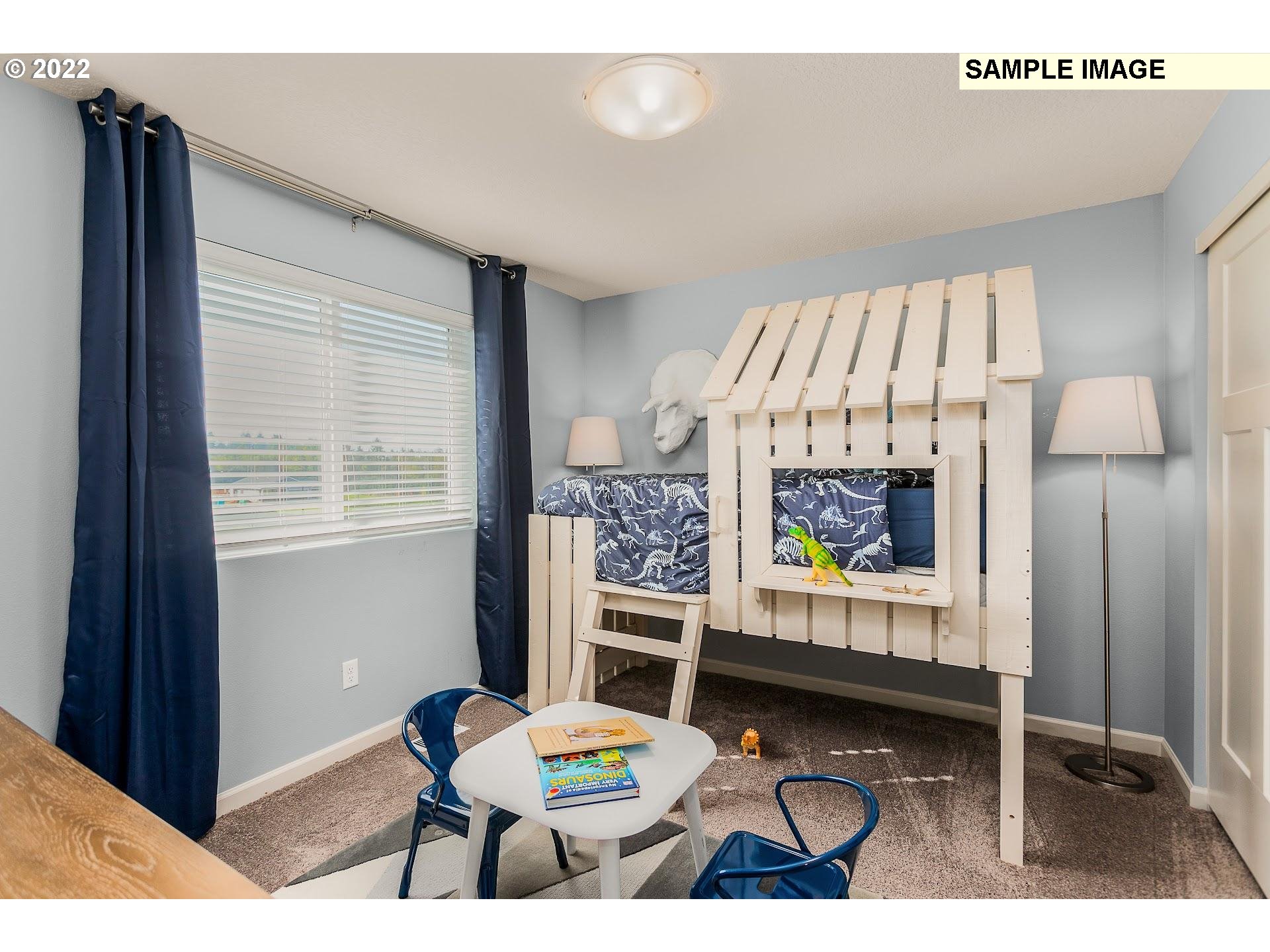 37413 Coho Street Sandy, OR 97055 - Photo 22 of 23 a living room with furniture and a table