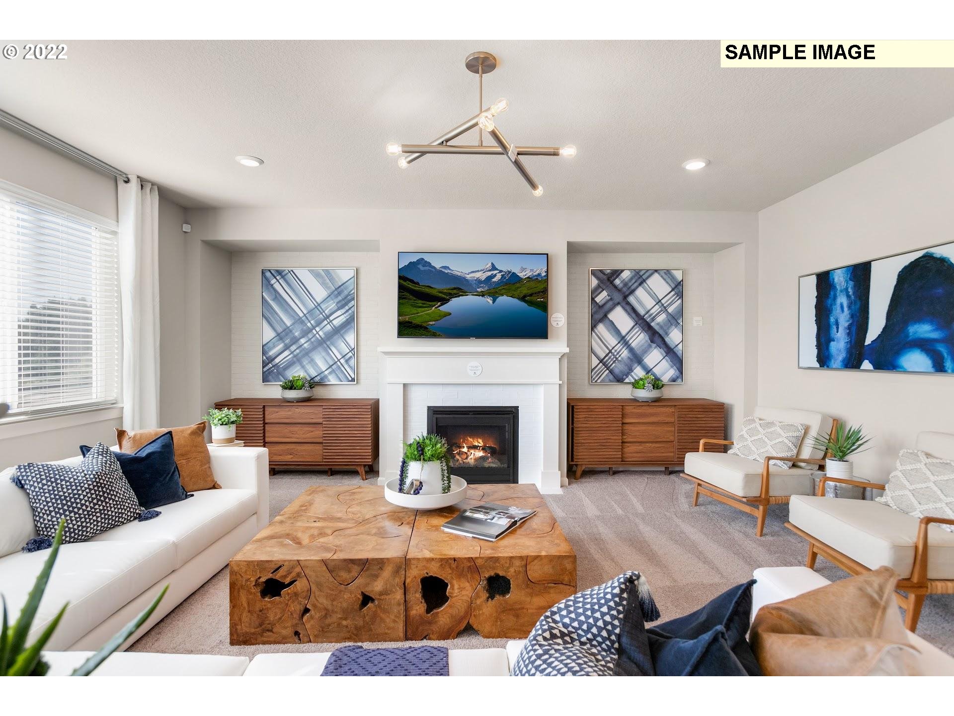 37413 Coho Street Sandy, OR 97055 - Photo 6 of 23 a living room with furniture and a fireplace