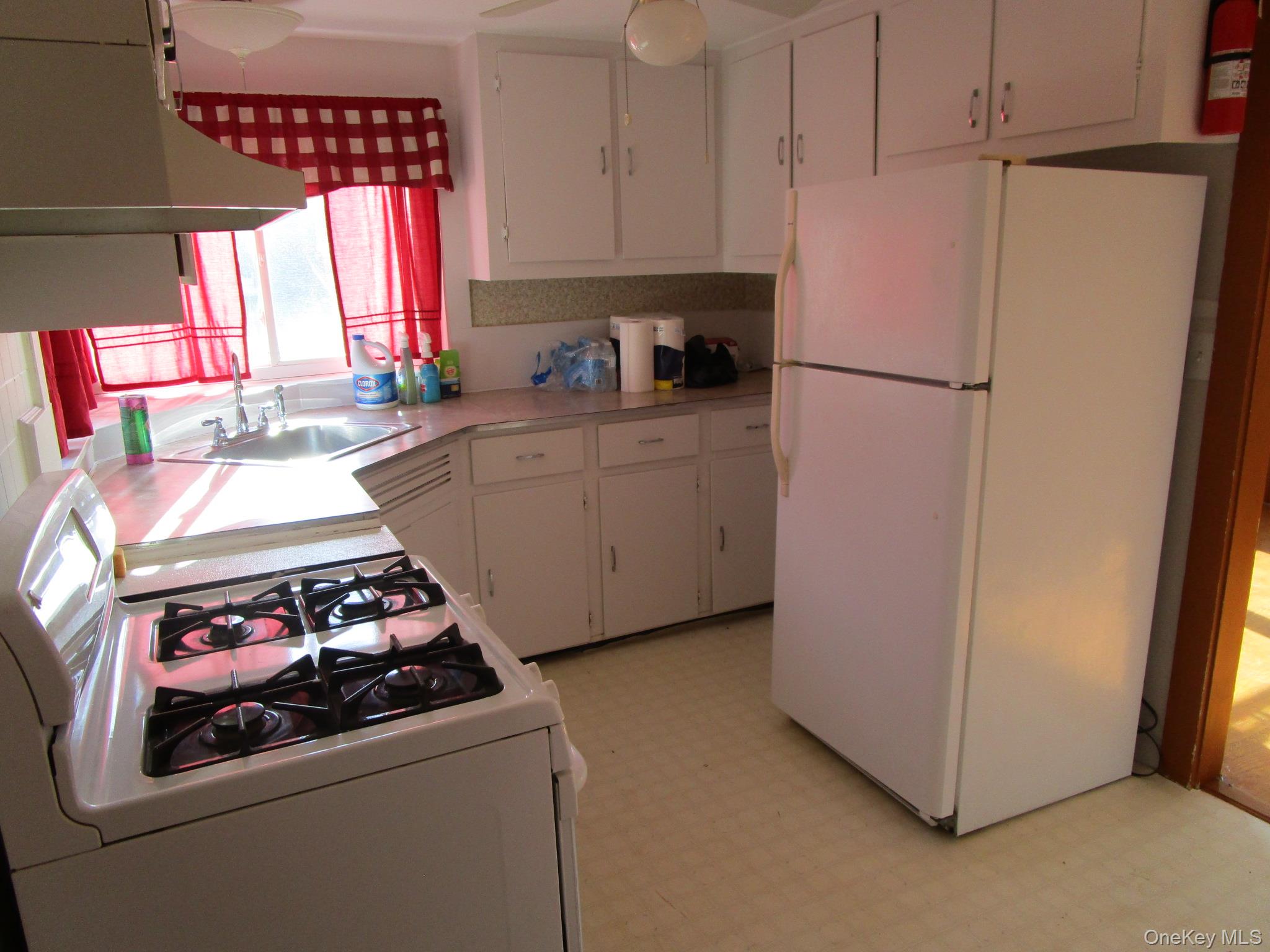36 Bert Crawford Road Middletown, NY 10940 - Photo 11 of 23 a kitchen with a white stove top oven and refrigerator