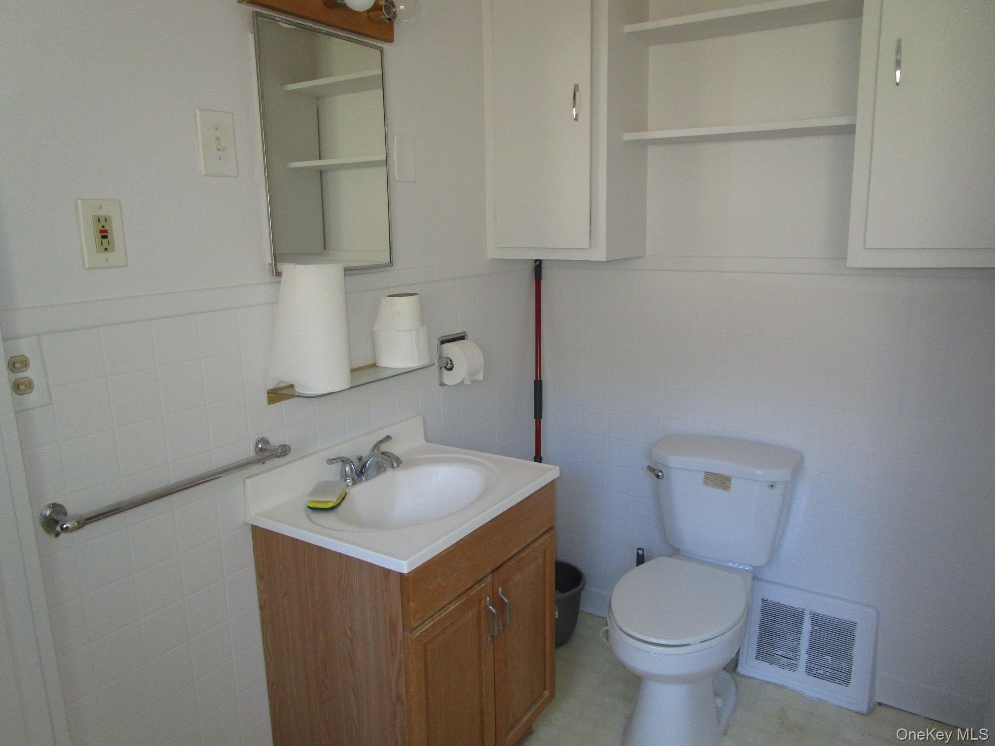 36 Bert Crawford Road Middletown, NY 10940 - Photo 13 of 23 a bathroom with a sink toilet and a mirror