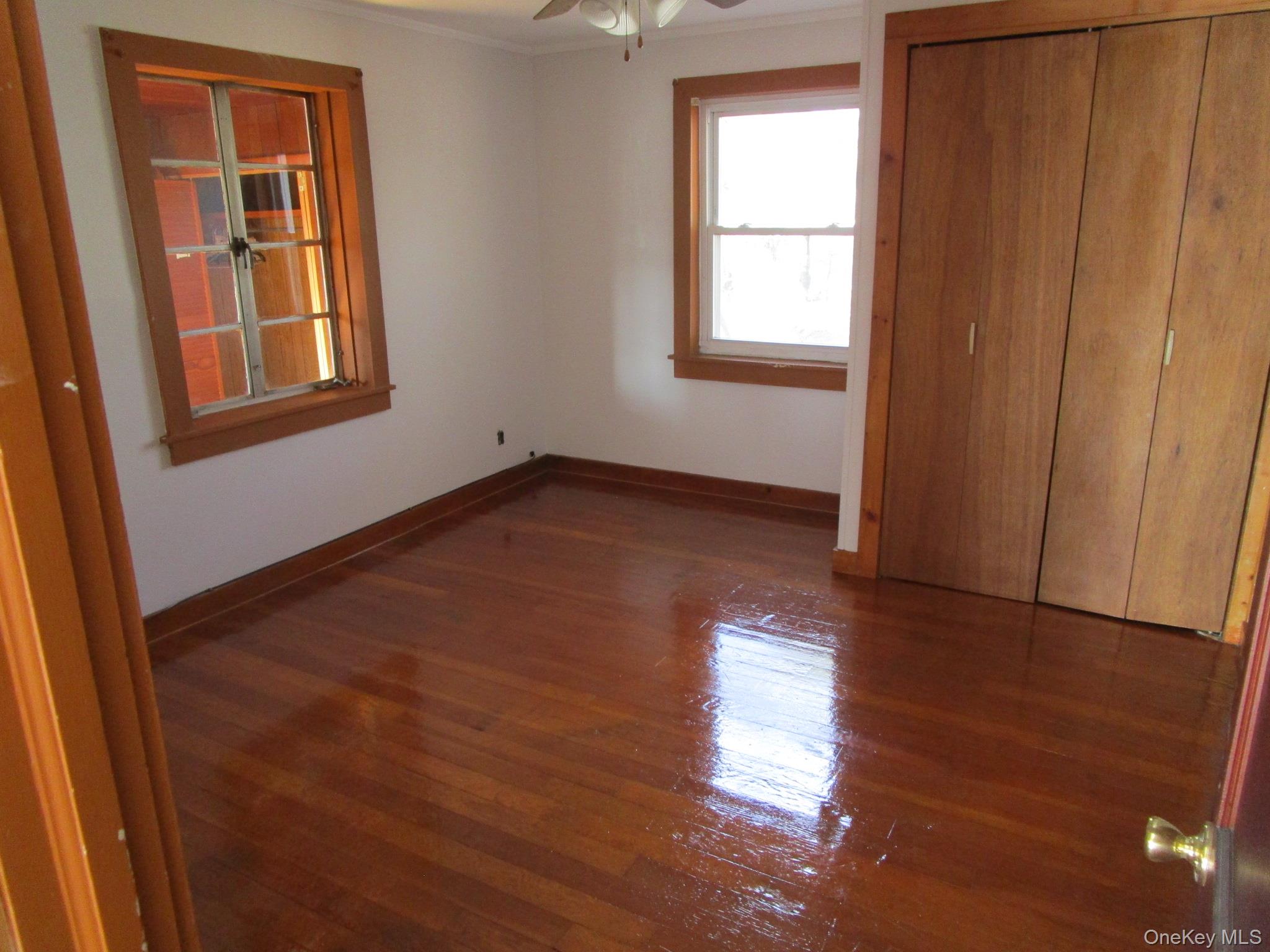 36 Bert Crawford Road Middletown, NY 10940 - Photo 6 of 23 an empty room with wooden floor and windows