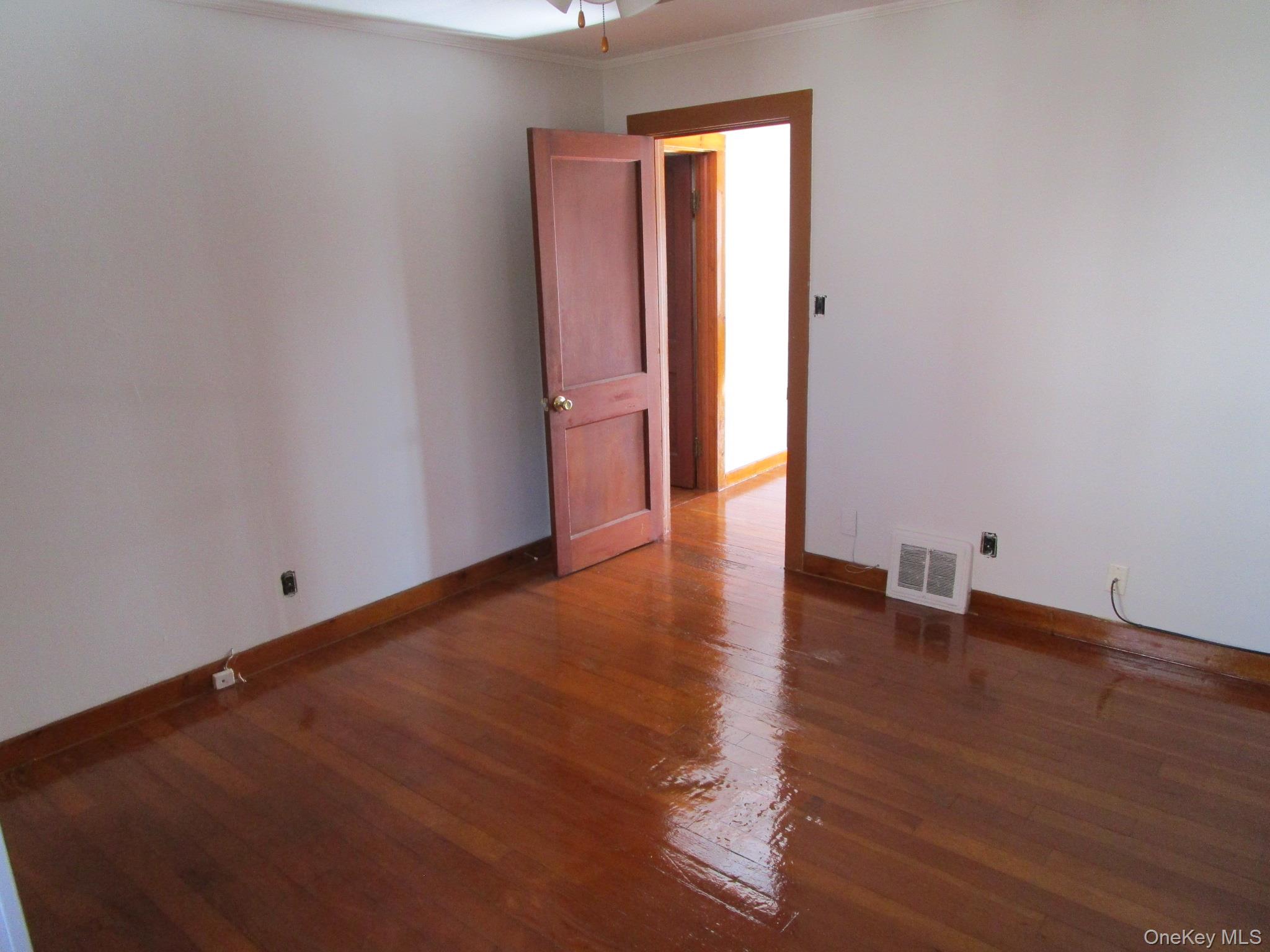 36 Bert Crawford Road Middletown, NY 10940 - Photo 7 of 23 a view of an empty room with wooden floor and a window