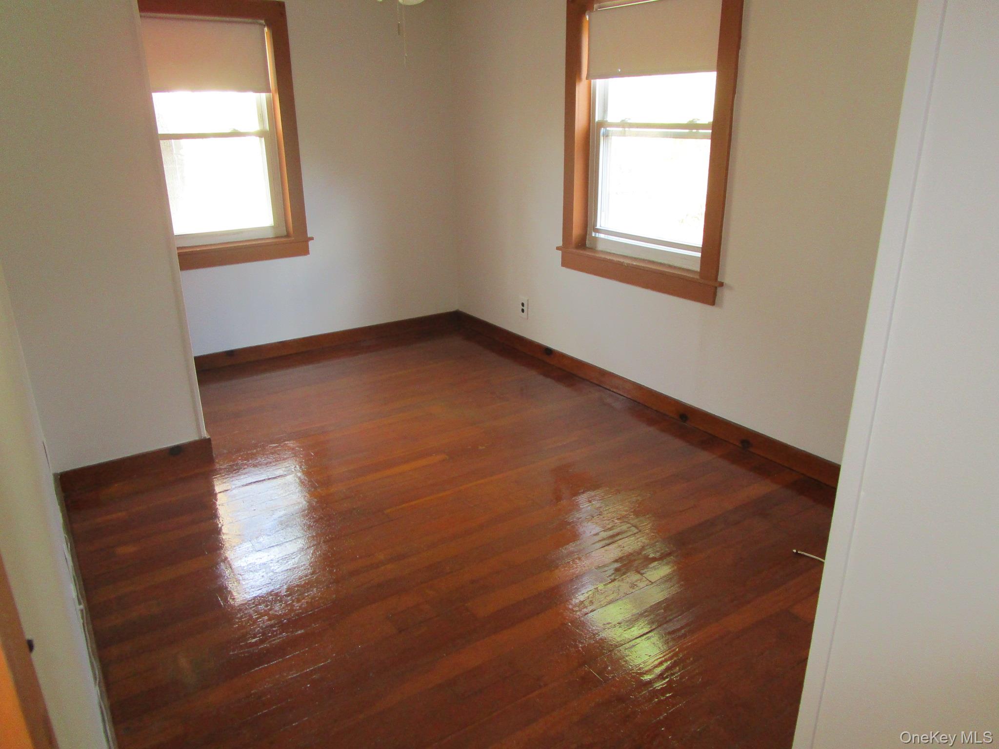36 Bert Crawford Road Middletown, NY 10940 - Photo 8 of 23 an empty room with wooden floor and windows