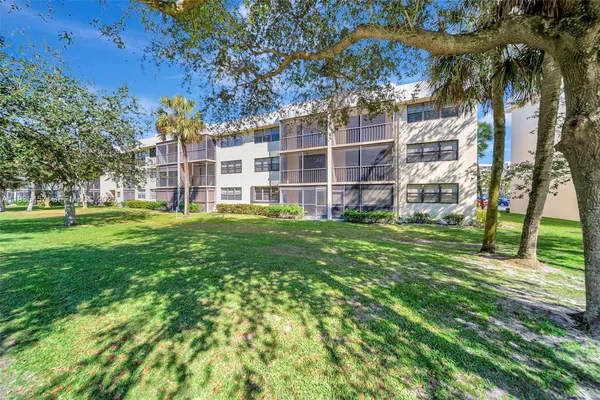 a view of a building with a big yard