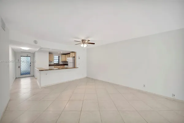 a view of a kitchen with a sink and a microwave