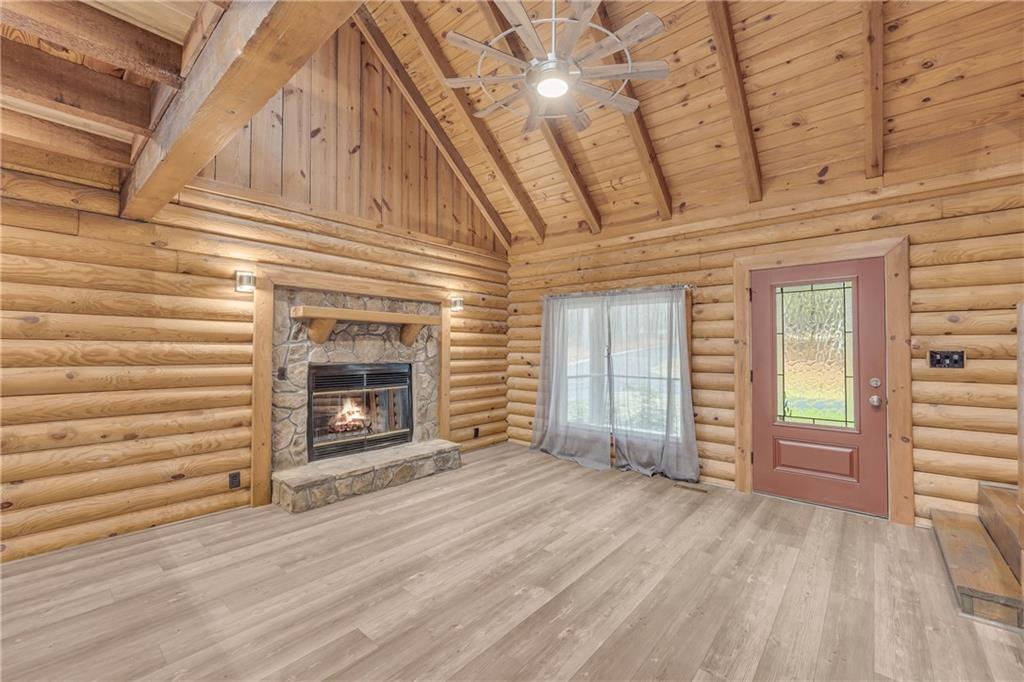 2885 Callie Still Road Lawrenceville, GA 30045 - Photo 26 of 79 a view of an empty room with exposed radiator and fireplace