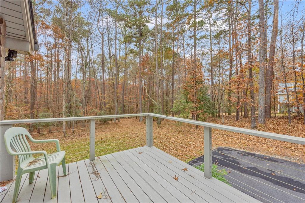 2885 Callie Still Road Lawrenceville, GA 30045 - Photo 32 of 79 a view of balcony with wooden floor and seating space