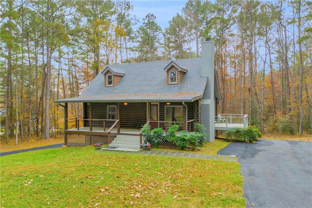 2885 Callie Still Road Lawrenceville, GA 30045 - Photo 4 of 79 a front view of a house with a yard