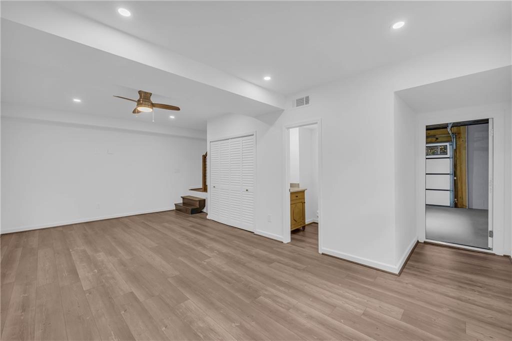 2885 Callie Still Road Lawrenceville, GA 30045 - Photo 42 of 79 a view of a big room with wooden floor and closet