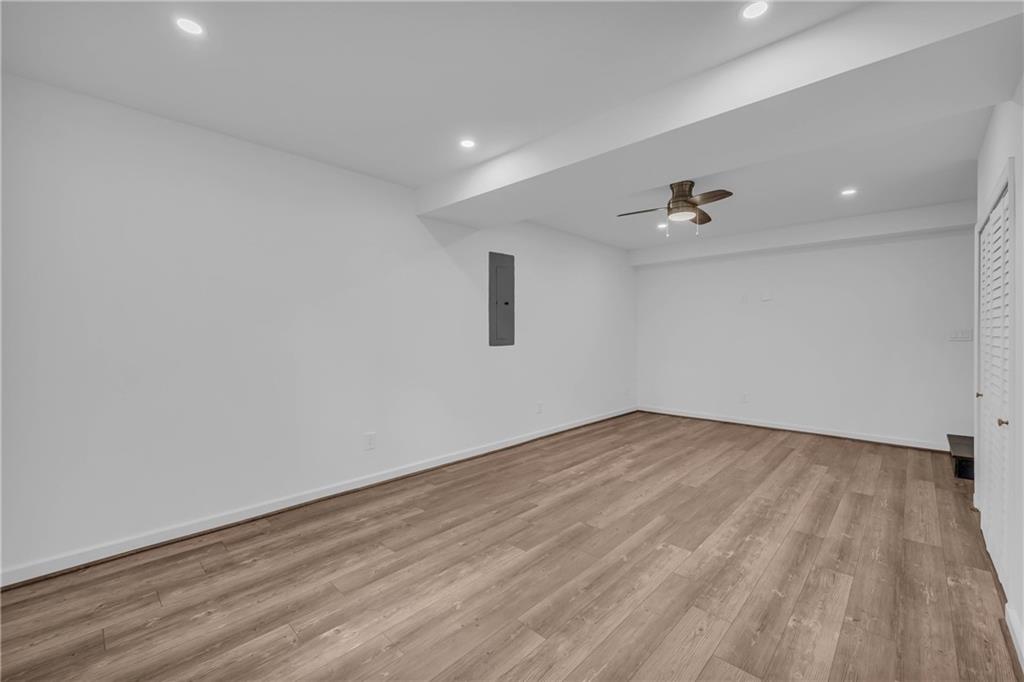 2885 Callie Still Road Lawrenceville, GA 30045 - Photo 43 of 79 a view of an empty room with wooden floor and a window