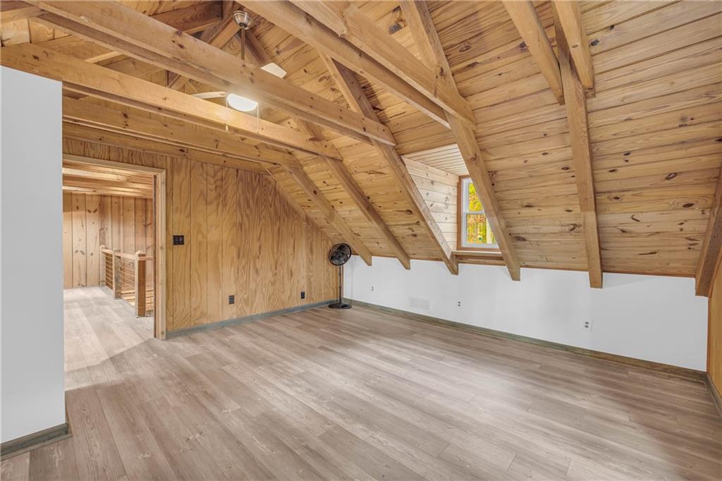 2885 Callie Still Road Lawrenceville, GA 30045 - Photo 55 of 79 an empty room with wooden floor and windows