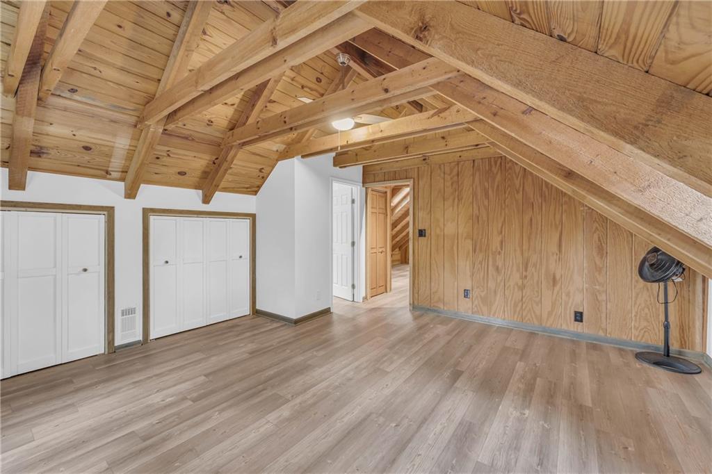 2885 Callie Still Road Lawrenceville, GA 30045 - Photo 56 of 79 a view of empty room with wooden floor