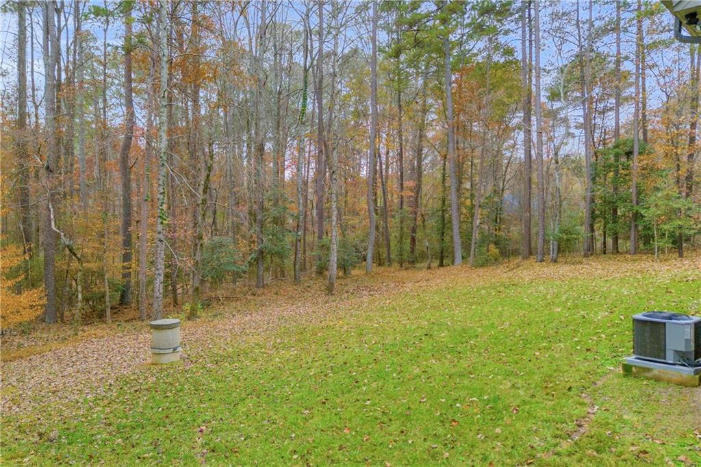 2885 Callie Still Road Lawrenceville, GA 30045 - Photo 8 of 79 a view of outdoor space with deck and yard