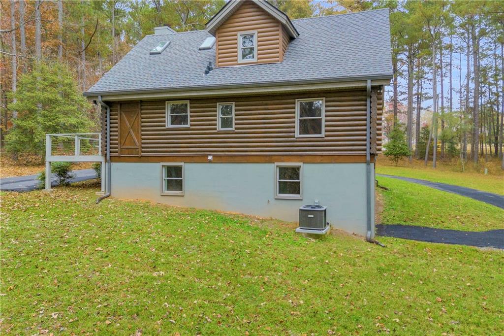 2885 Callie Still Road Lawrenceville, GA 30045 - Photo 9 of 79 a front view of a house with a yard