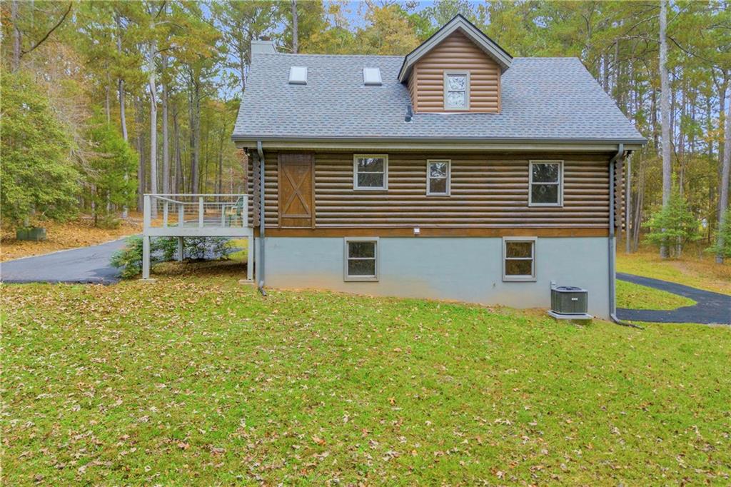 2885 Callie Still Road Lawrenceville, GA 30045 - Photo 10 of 79 a front view of a house with yard and green space