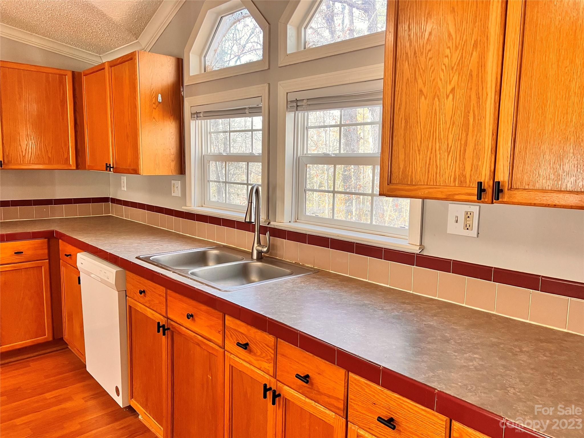 1864 Coopers Gap Road Rutherfordton, NC 28139 - Photo 17 of 46 a kitchen with stainless steel appliances granite countertop a sink a granite counter tops and a large window