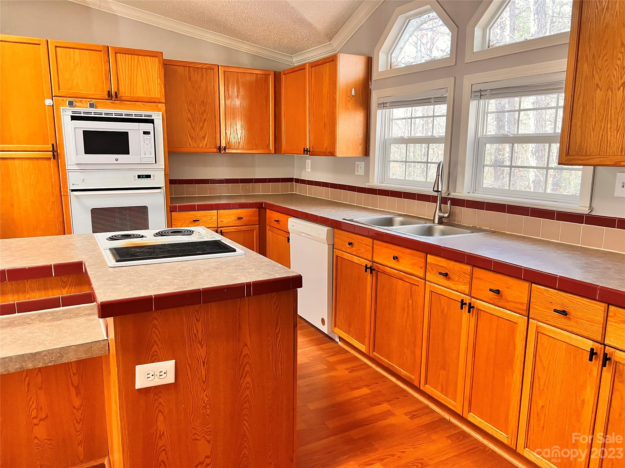 1864 Coopers Gap Road Rutherfordton, NC 28139 - Photo 18 of 46 a kitchen with stainless steel appliances granite countertop a stove a sink and a microwave