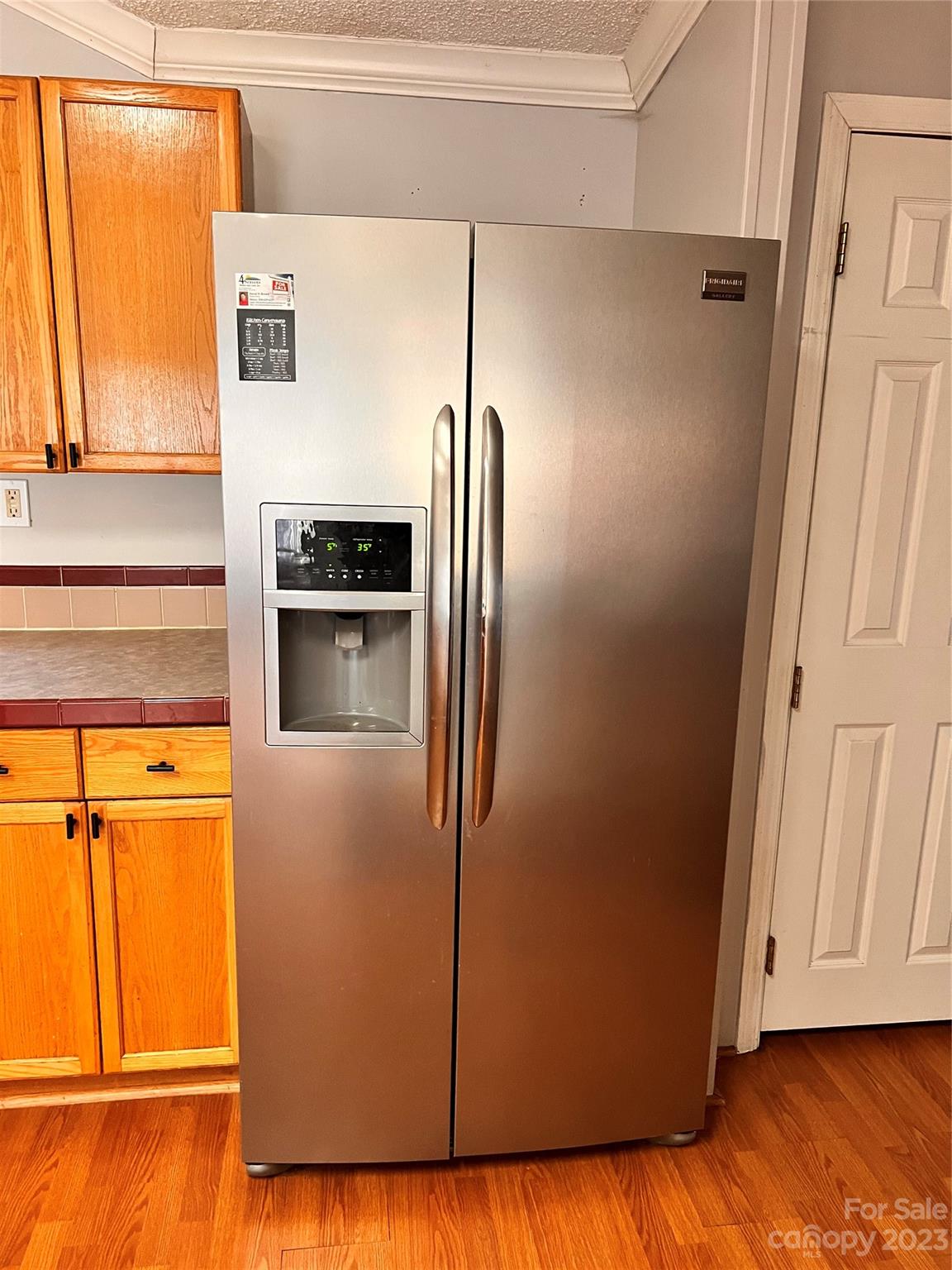 1864 Coopers Gap Road Rutherfordton, NC 28139 - Photo 20 of 46 a kitchen with metallic refrigerator and wooden floor