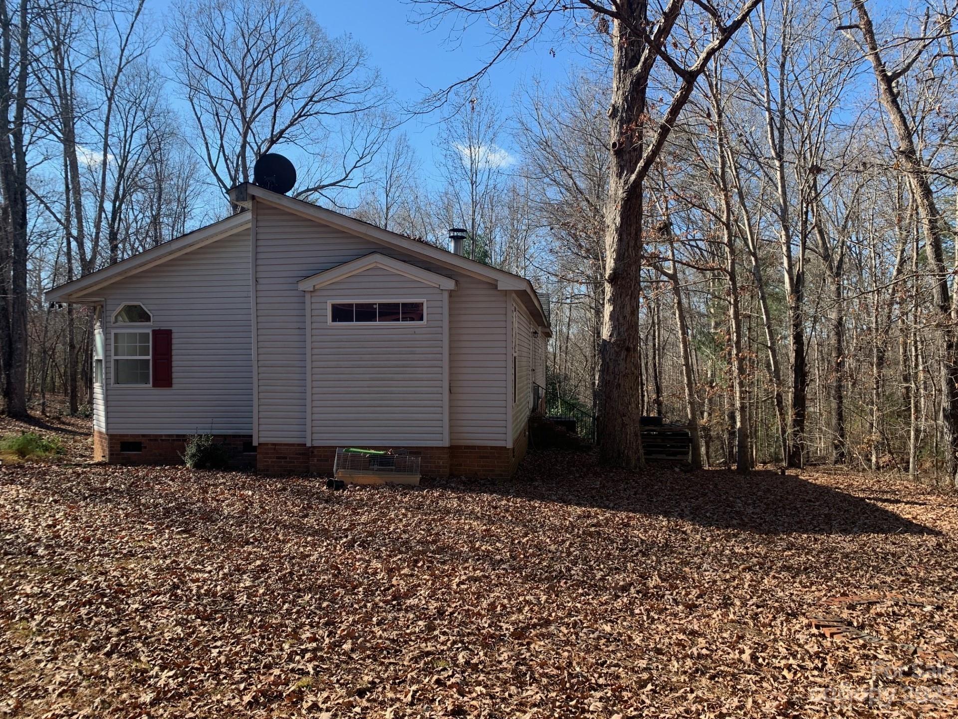 1864 Coopers Gap Road Rutherfordton, NC 28139 - Photo 2 of 46 a front view of a house with a yard