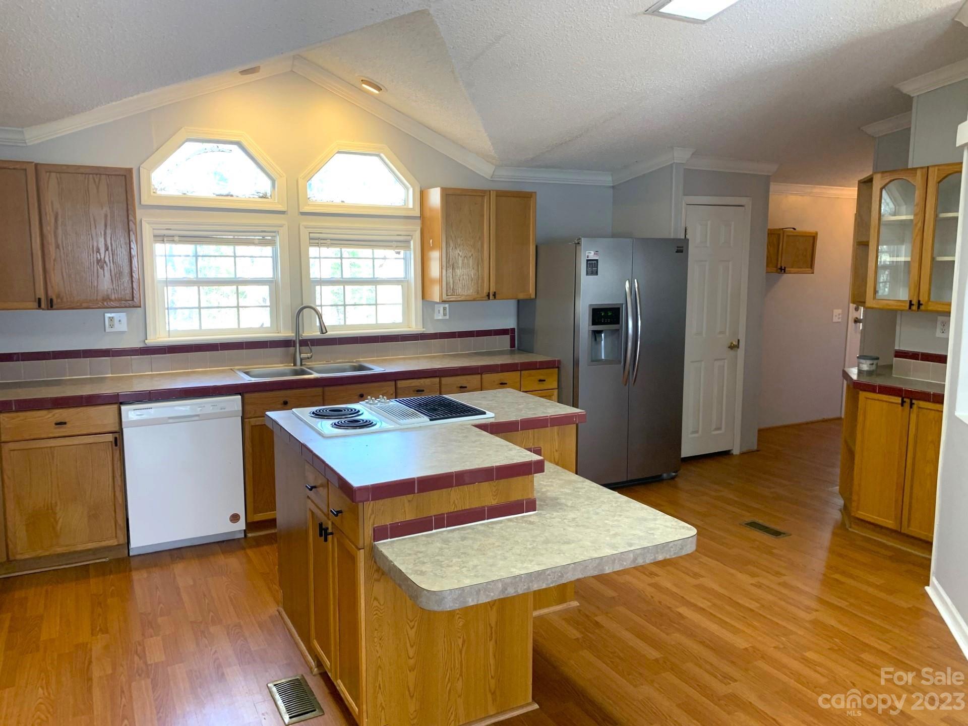 1864 Coopers Gap Road Rutherfordton, NC 28139 - Photo 21 of 46 a kitchen with a refrigerator and a stove top oven