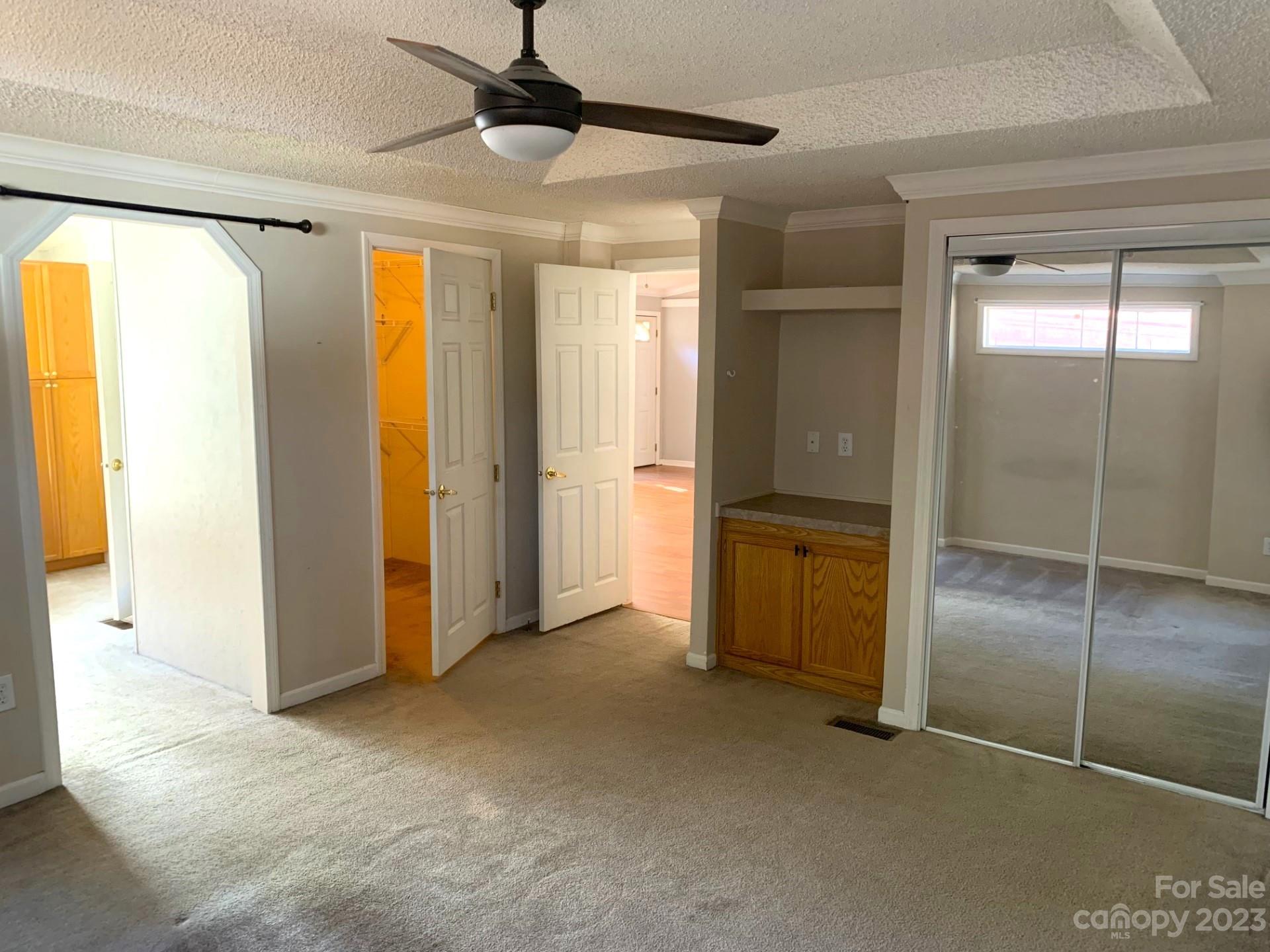 1864 Coopers Gap Road Rutherfordton, NC 28139 - Photo 27 of 46 a view of an empty room with a fireplace and a chandelier
