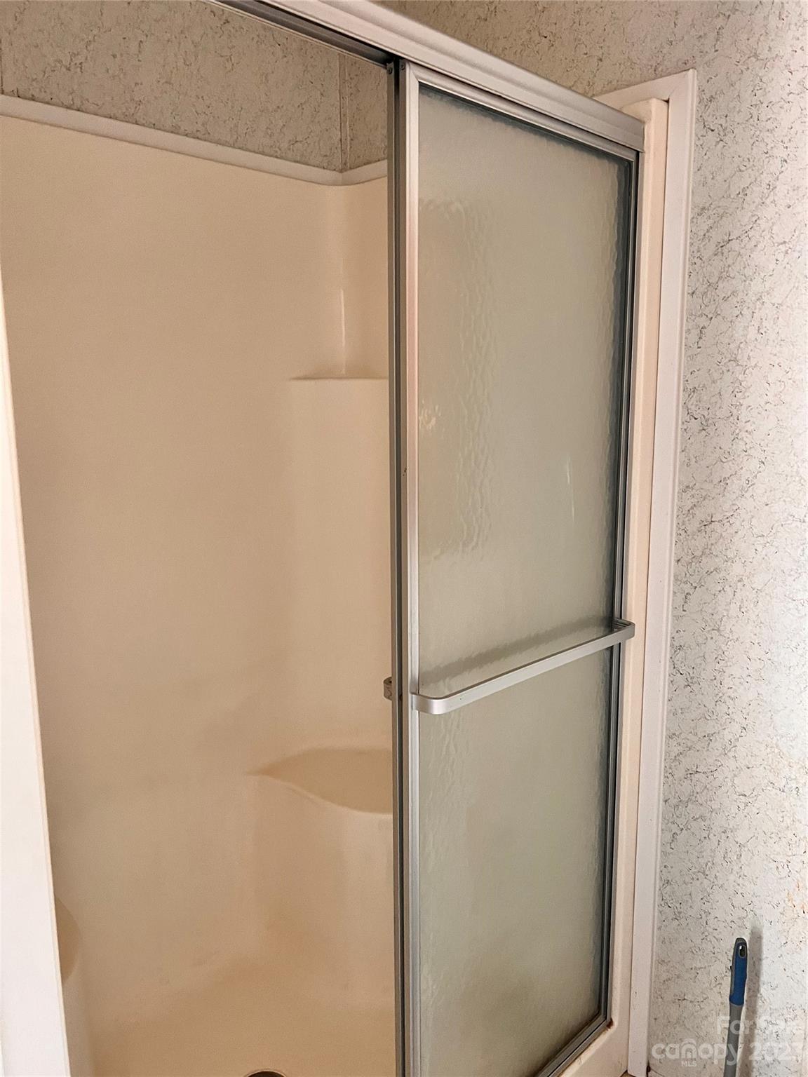 1864 Coopers Gap Road Rutherfordton, NC 28139 - Photo 33 of 46 a bathroom with a glass shower door