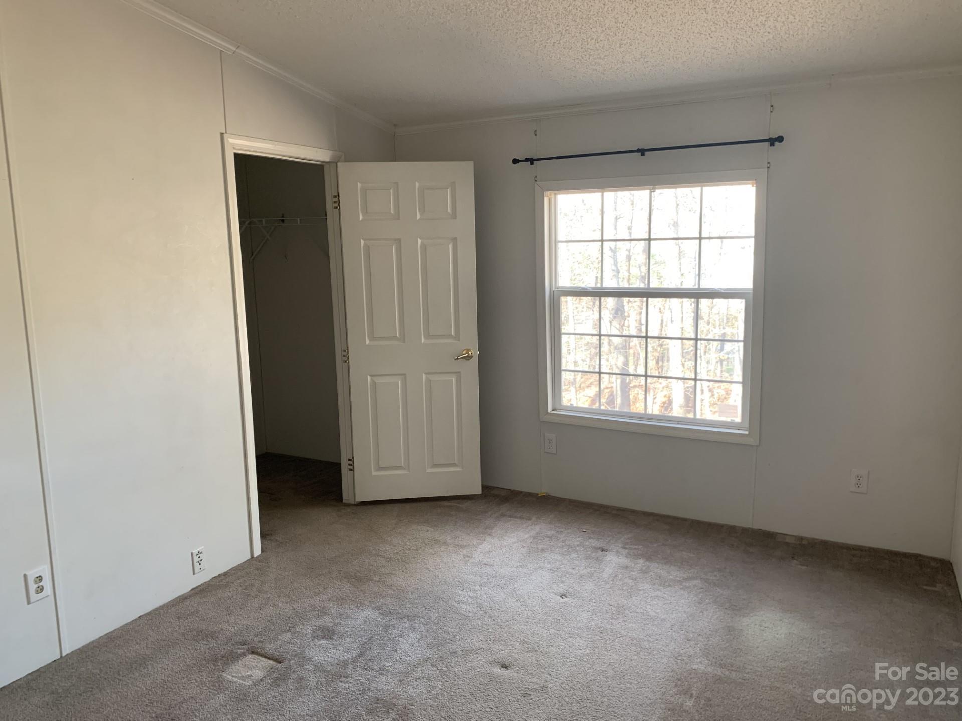 1864 Coopers Gap Road Rutherfordton, NC 28139 - Photo 34 of 46 an empty room with a window