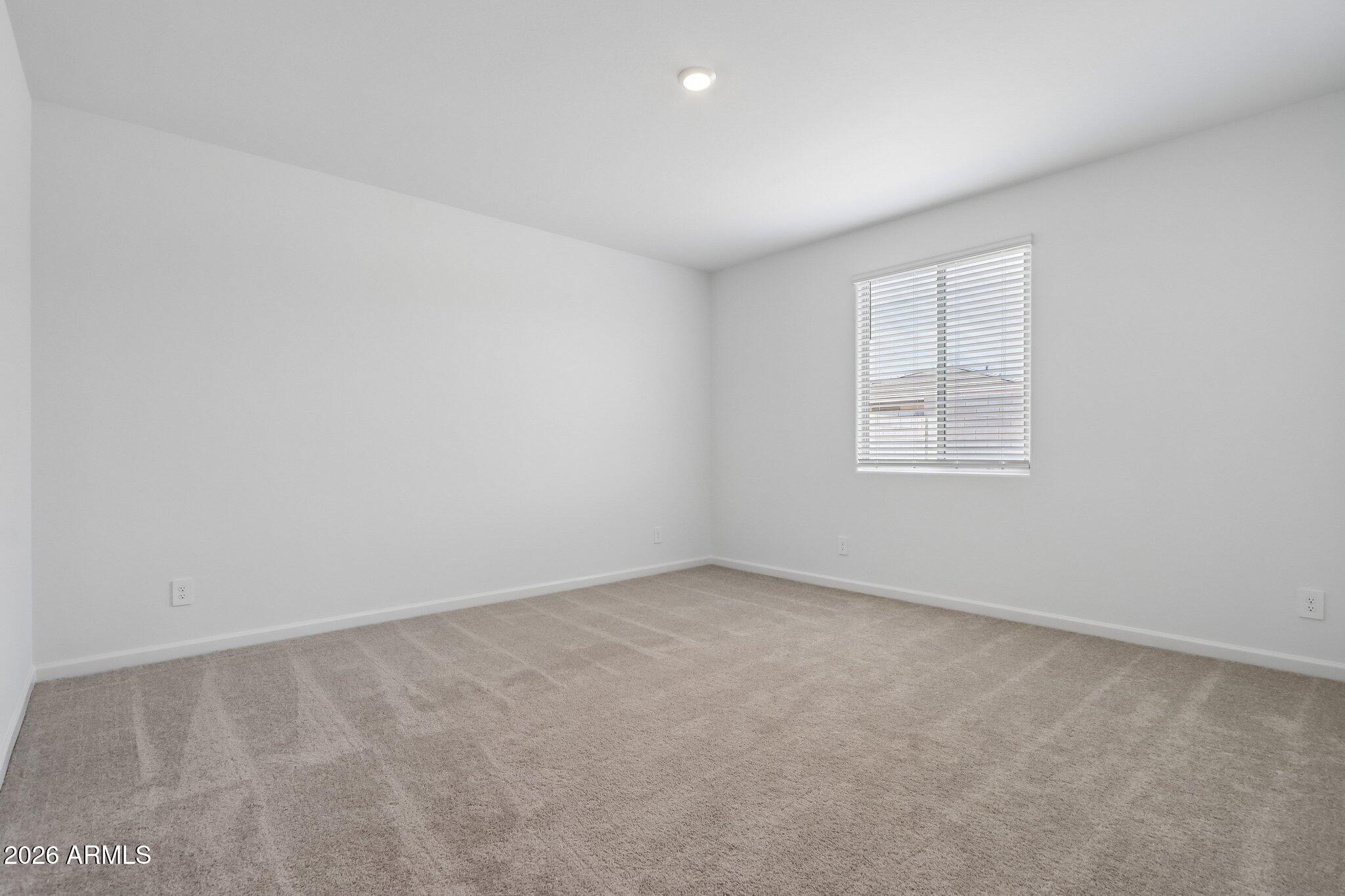 9544 West Gaby Road Tolleson, AZ 85353 - Photo 18 of 43 an empty room with windows