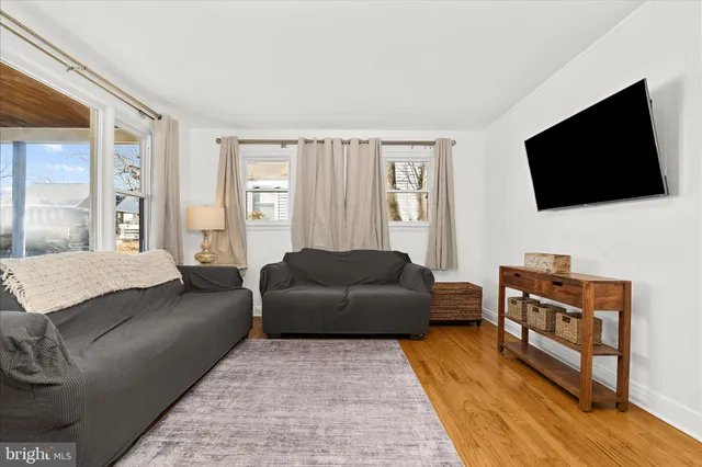 a white toilet sitting next to a shower curtain