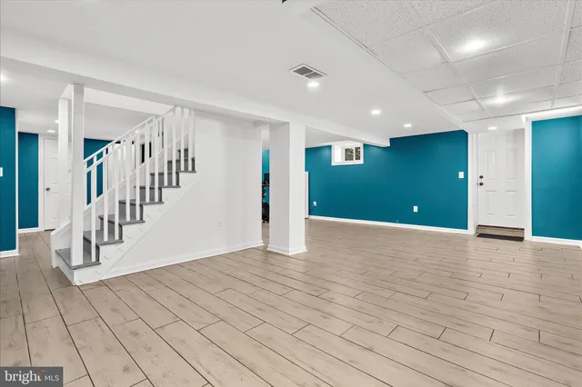 a bed room with a bed and a television