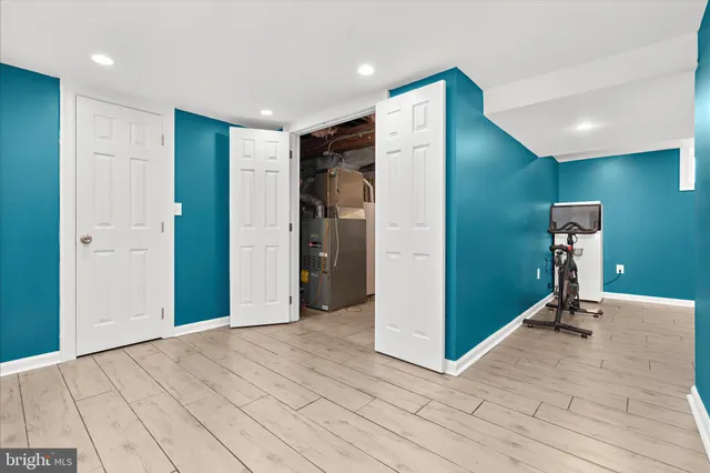 a view of a room with gym equipment and a window