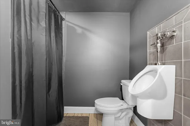 a view of a house with a yard and roof deck