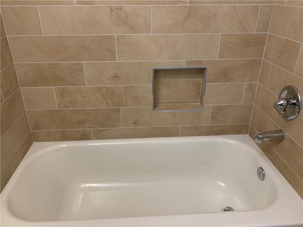 1261 Concord Road Southeast Smyrna, GA 30080 - Photo 16 of 50 a bathroom with a bathtub