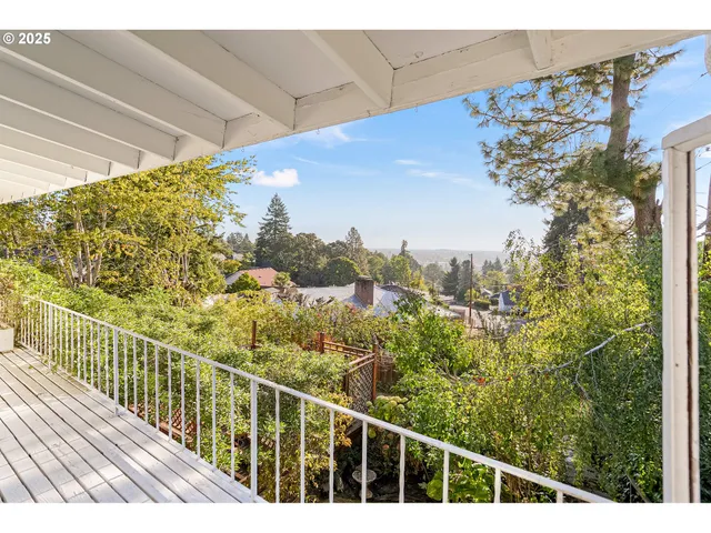 a view of balcony with wooden floor