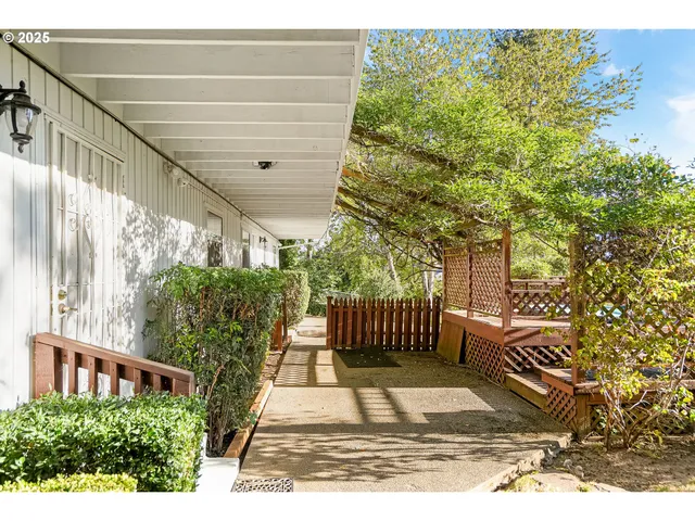 a view of a balcony with wooden floor