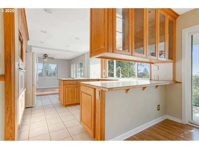a view of kitchen with furniture and large window