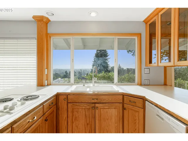 a bathroom with a sink and a large window