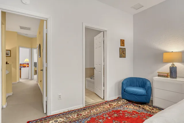 a living room with furniture and a rug