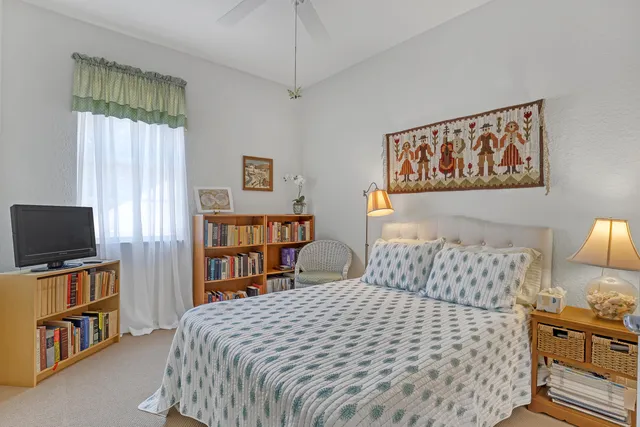 a bedroom with a bed and a television in it