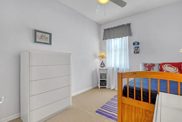 a bedroom with furniture and a window