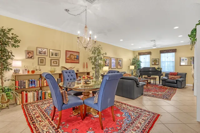 a living room with lots of furniture and a chandelier