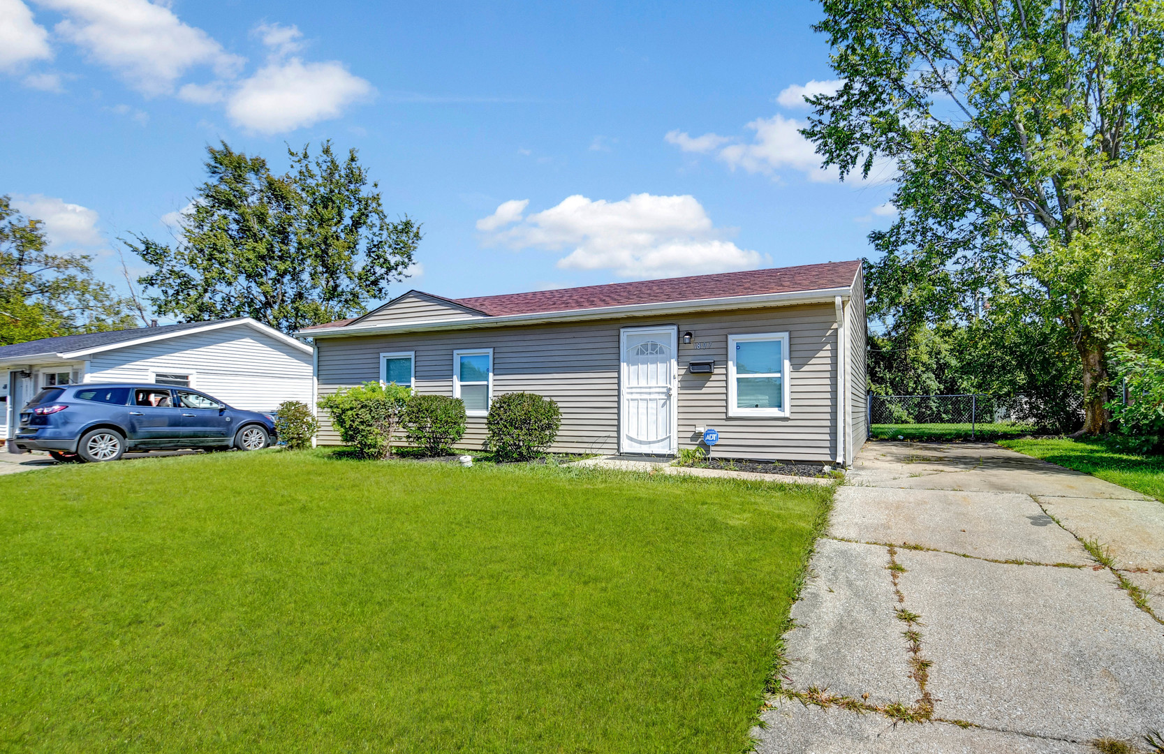1897 Division Street Chicago Heights, IL 60411 - Photo 1 of 14 a front view of house with yard and green space