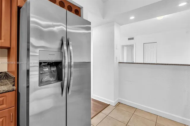 a bathroom with a glass shower door and a sink