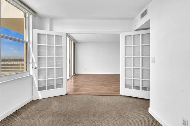 an empty room with windows