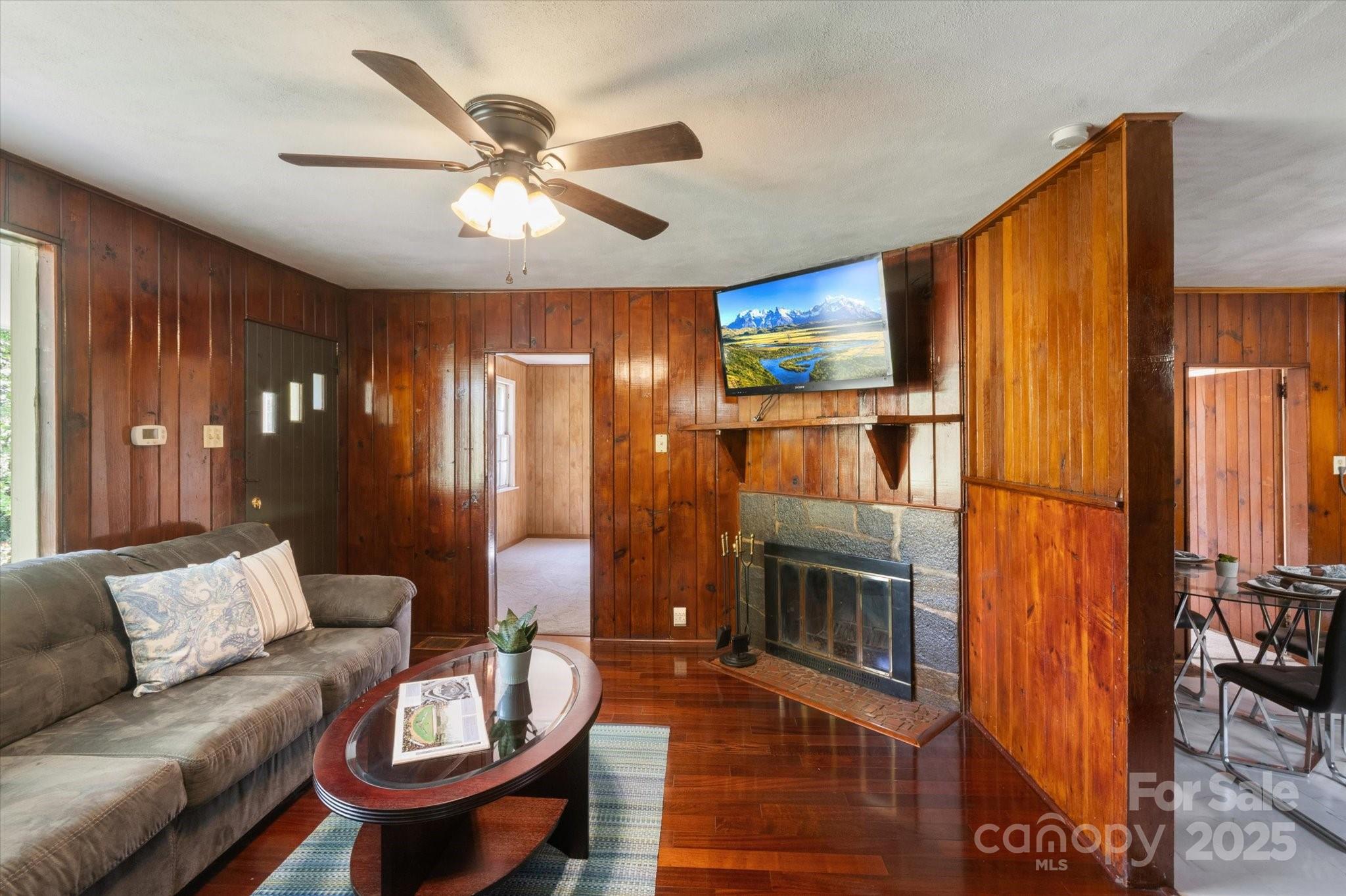 35 Homeway Road Asheville, NC 28806 - Photo 13 of 32 a living room with furniture a fireplace and a chandelier