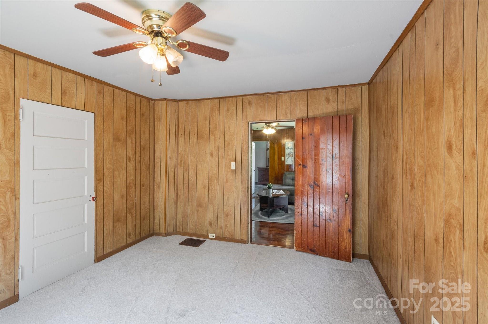 35 Homeway Road Asheville, NC 28806 - Photo 17 of 32 wooden floor in an empty room with a window